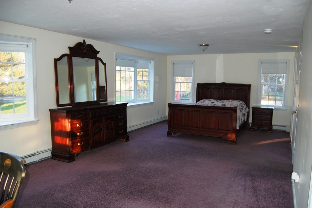 64 Paul Road Hanover, MA 02339 - Photo 8 of 12 a living room with furniture and a window