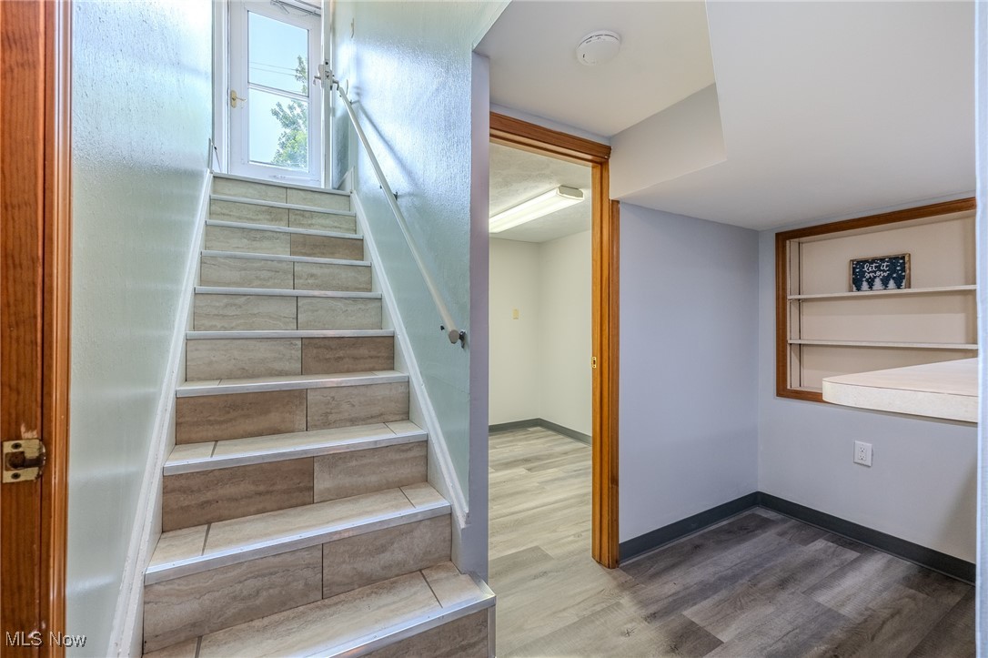29971 Regent Road Wickliffe, OH 44092 - Photo 27 of 39 Staircase featuring wood finished floors and baseboards