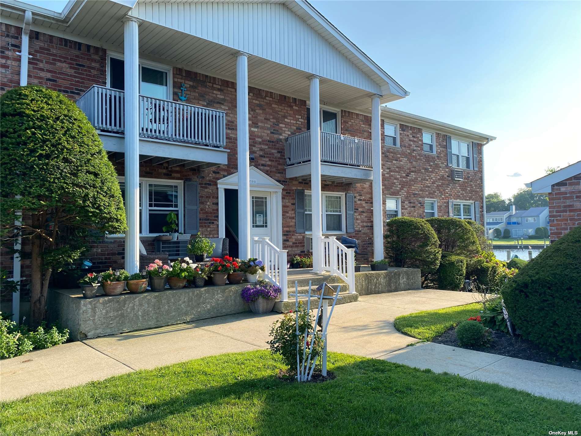 a view of a house with a yard porch and sitting area