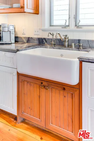 a kitchen with a sink and cabinets