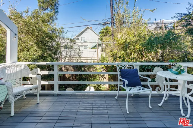 a view of a chairs and table in the patio