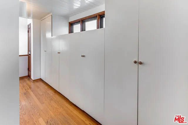 a view of a hallway with closet