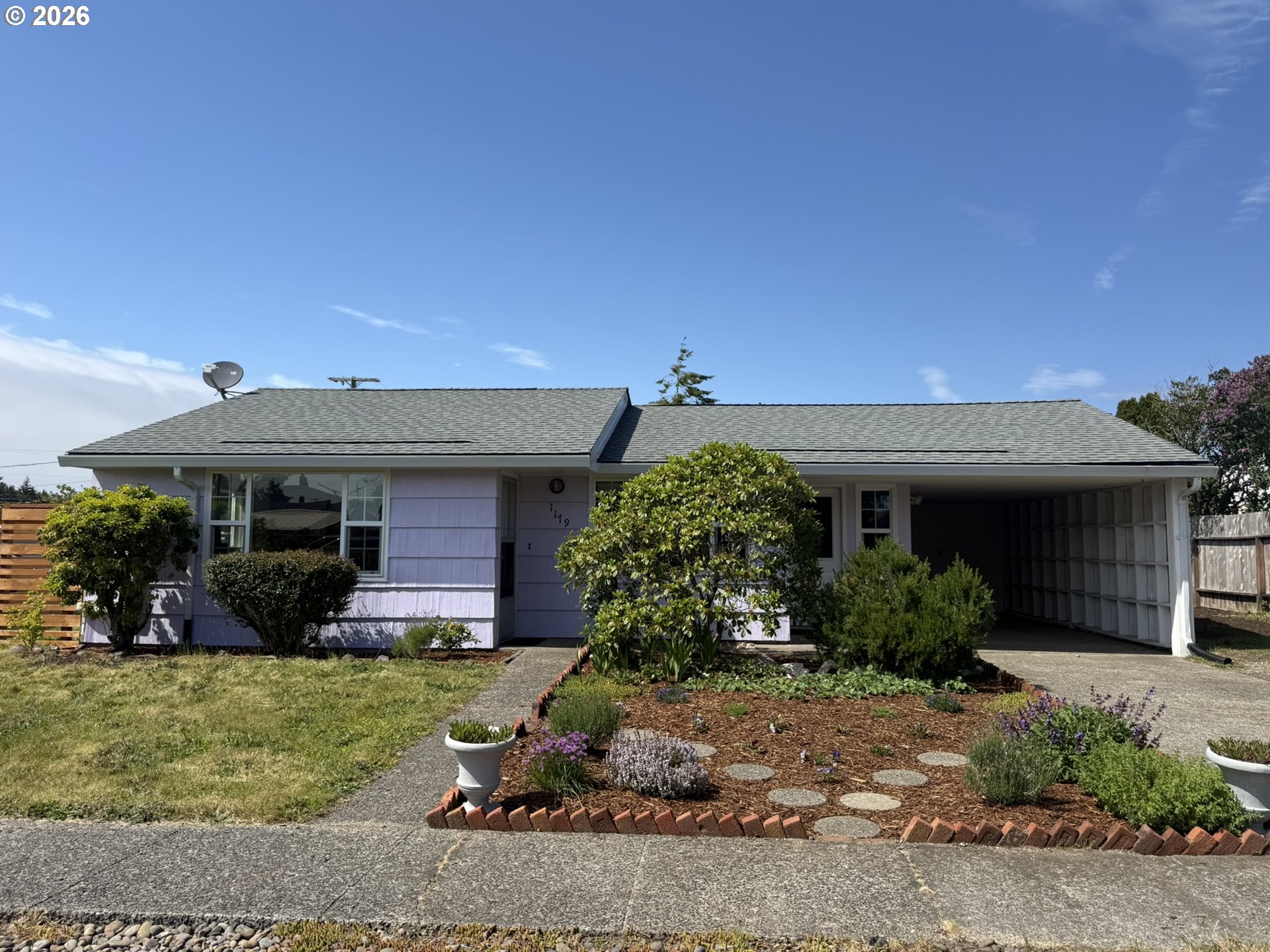 1179 6th Street Florence, OR 97439 - Photo 1 of 26 front view of a house with a yard