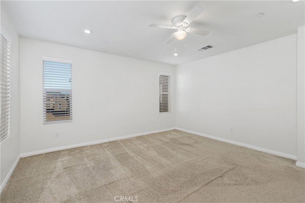 913 Helena Ridge Lake Elsinore, CA 92530 - Photo 22 of 38 wooden floor in an empty room with a window
