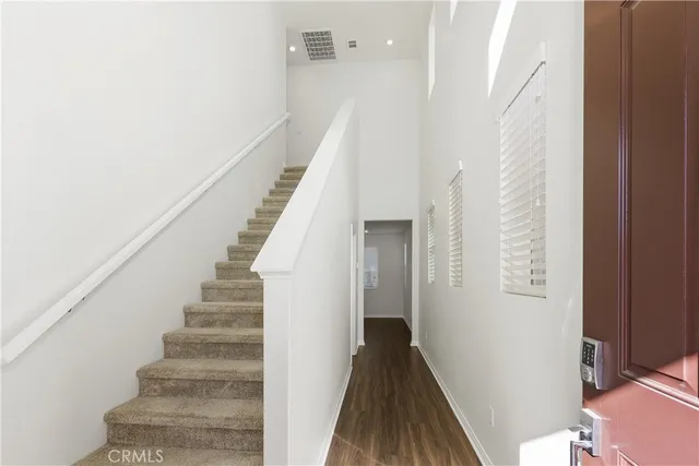 a view of entryway with wooden floor