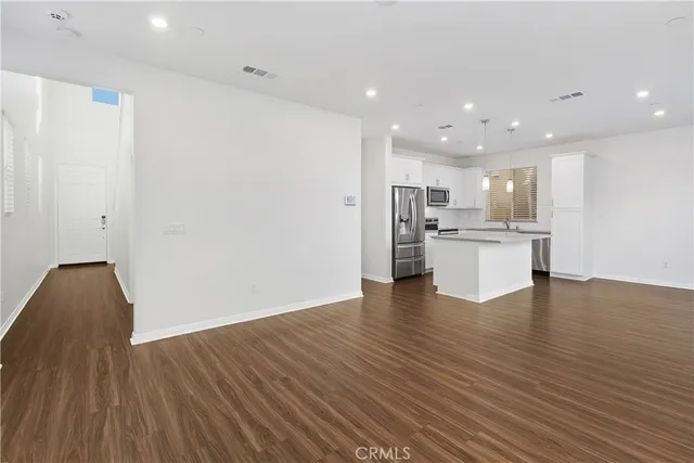 a view of kitchen view wooden floor and window