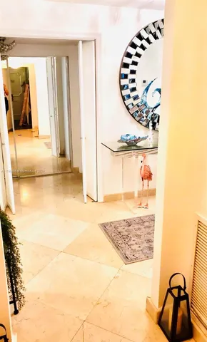 a bedroom with a bed and a mirror