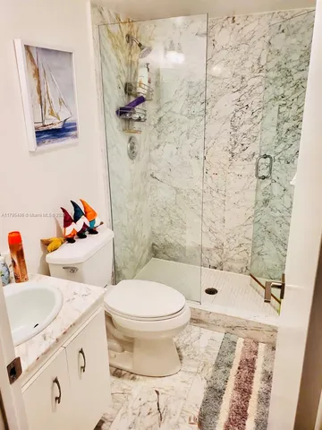 a bedroom with two beds and a window