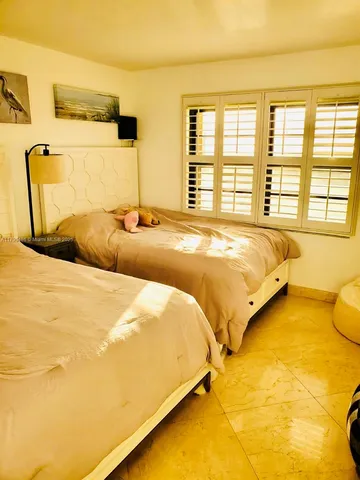 a view of a swimming pool with a yard