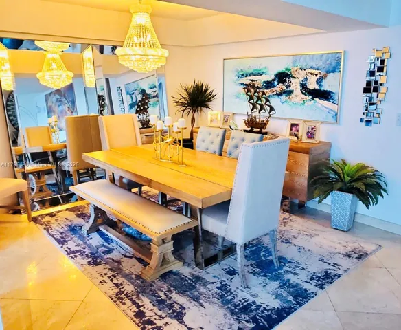 a hallway with a couch and a potted plant