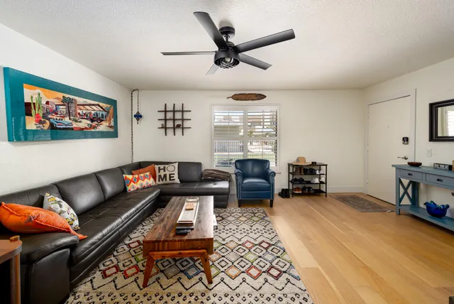 a kitchen with stainless steel appliances granite countertop a refrigerator and a stove