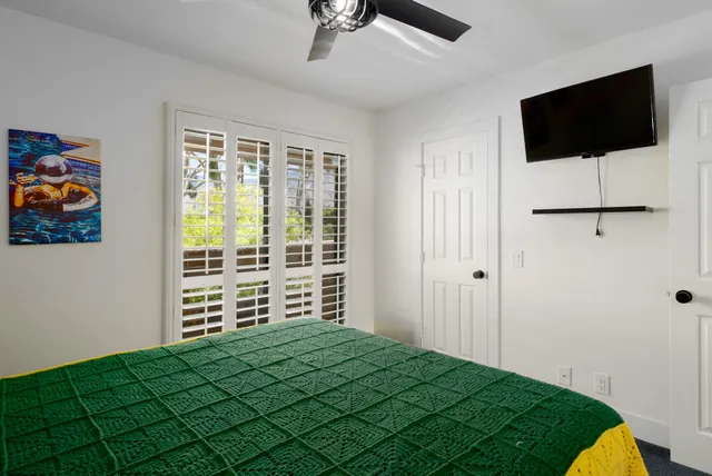 a view of a street with potted plants