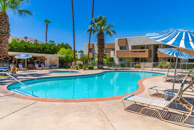 a view of a swimming pool with a lounge chairs