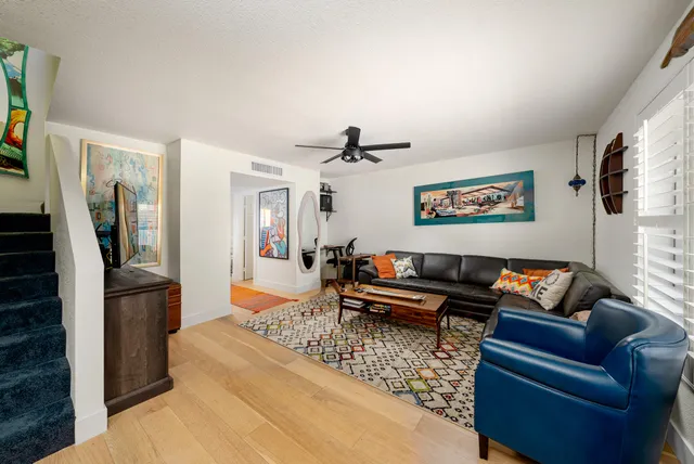 a bedroom with furniture and flat screen tv