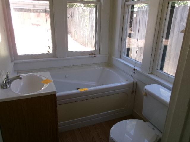 446 Merrick Street Shreveport, LA 71104 - Photo 14 of 16 a bathroom with a sink and a toilet