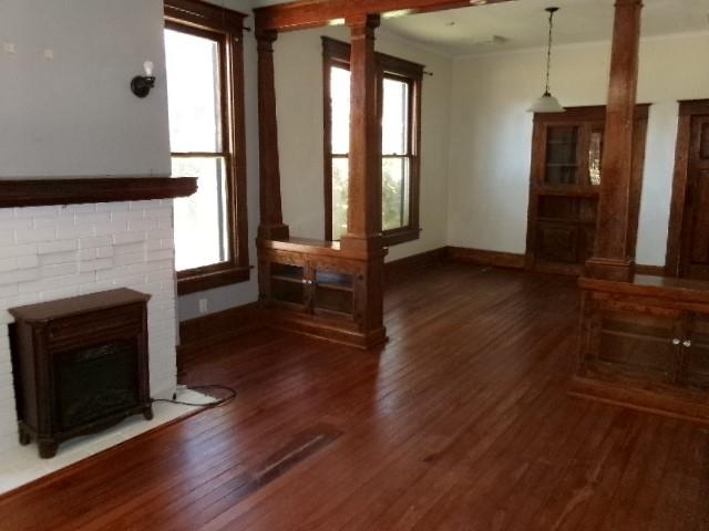 446 Merrick Street Shreveport, LA 71104 - Photo 7 of 16 a living room with hard wood floors and a fireplace
