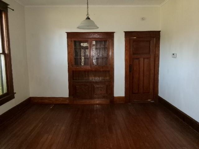 446 Merrick Street Shreveport, LA 71104 - Photo 8 of 16 an empty room with wooden floor and closet