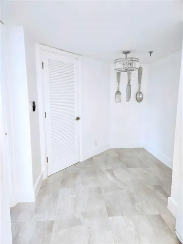 a view of a refrigerator and chandelier in it