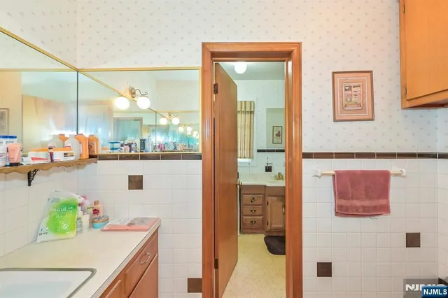 a kitchen with a refrigerator and a table