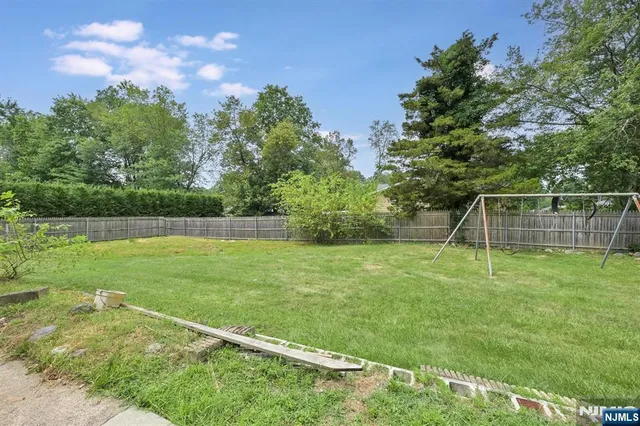 a view of a backyard with a slide
