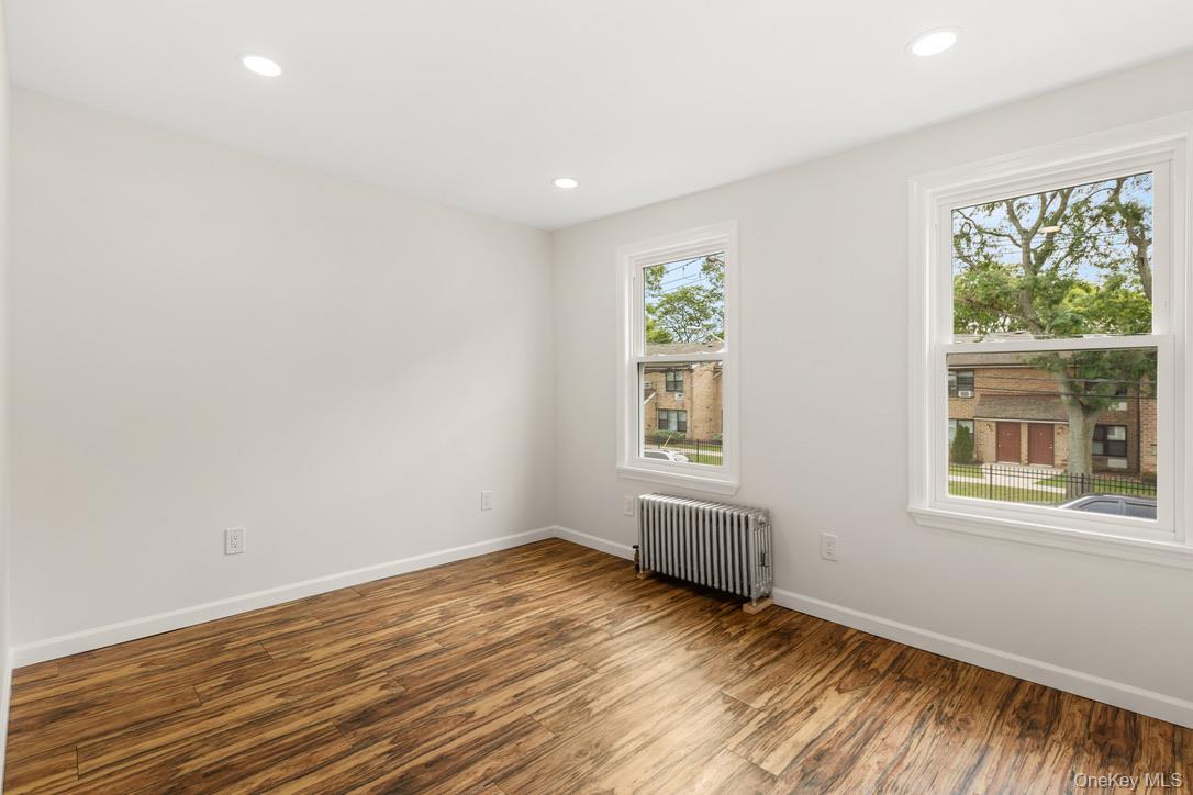 31 Grove Street Hempstead, NY 11550 - Photo 13 of 17 an empty room with windows