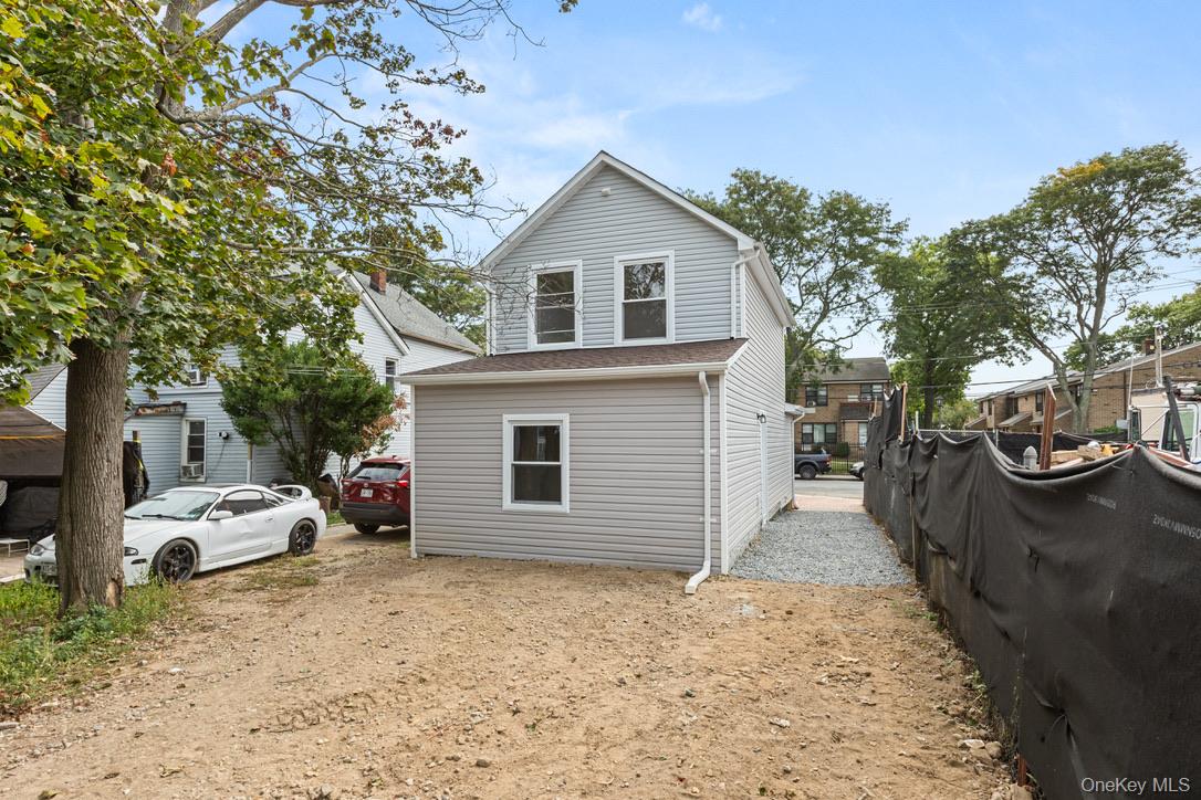 31 Grove Street Hempstead, NY 11550 - Photo 17 of 17 a view of a house with a yard