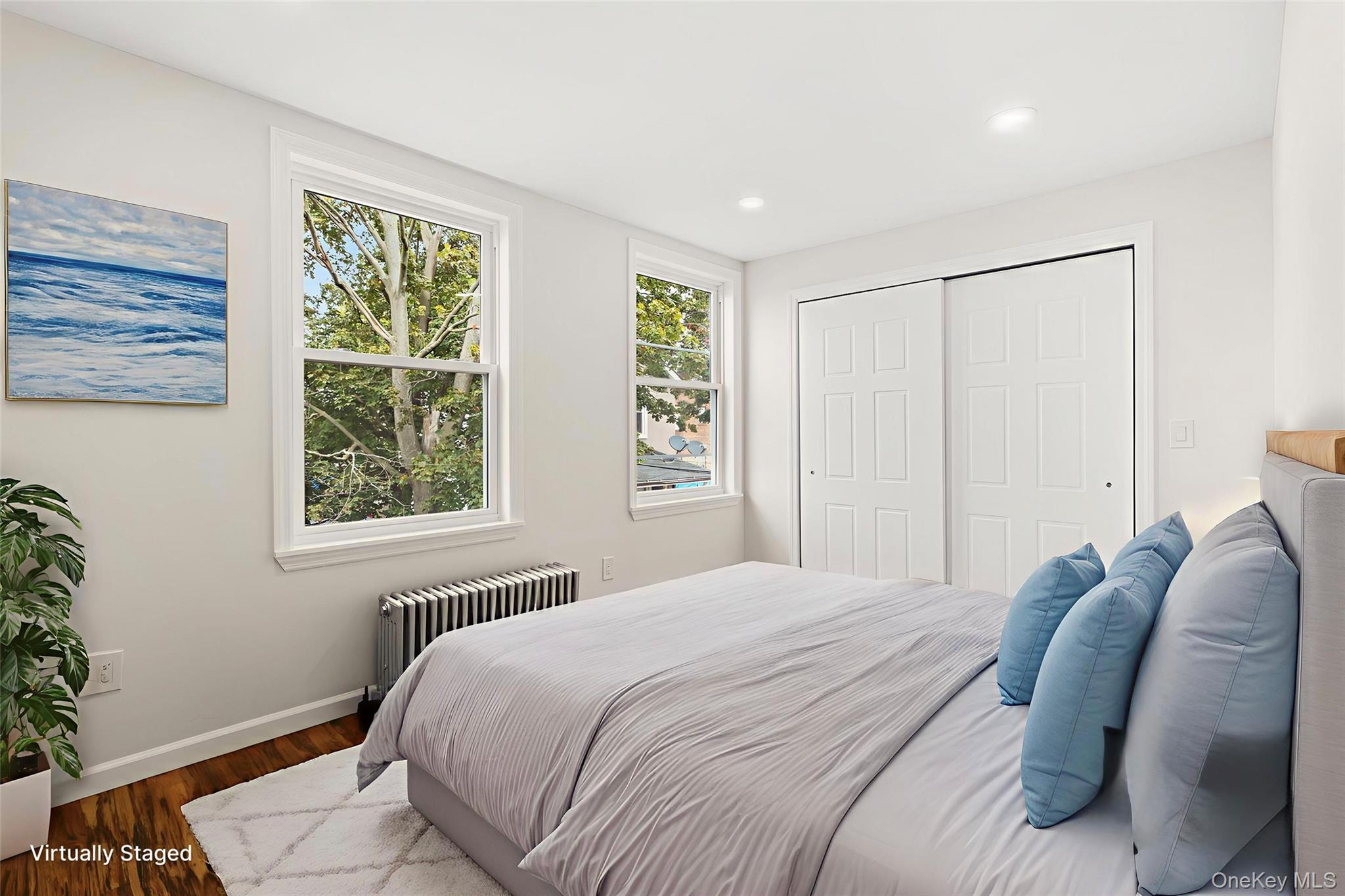 31 Grove Street Hempstead, NY 11550 - Photo 9 of 17 a bedroom with a bed and a window