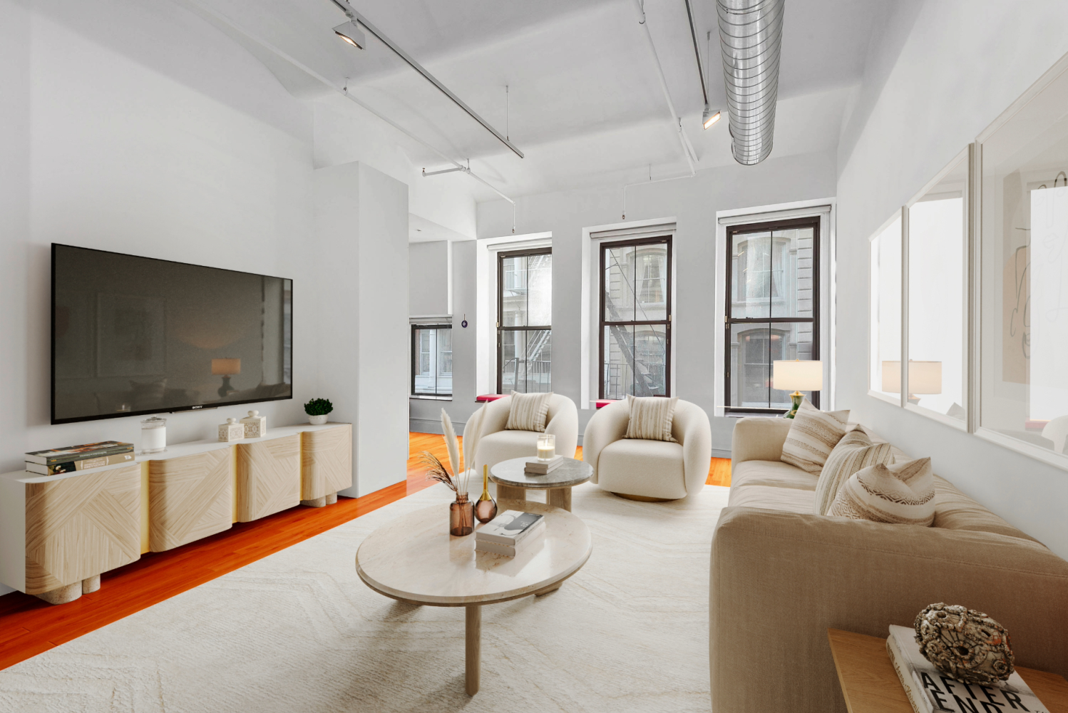 a living room with furniture and a flat screen tv