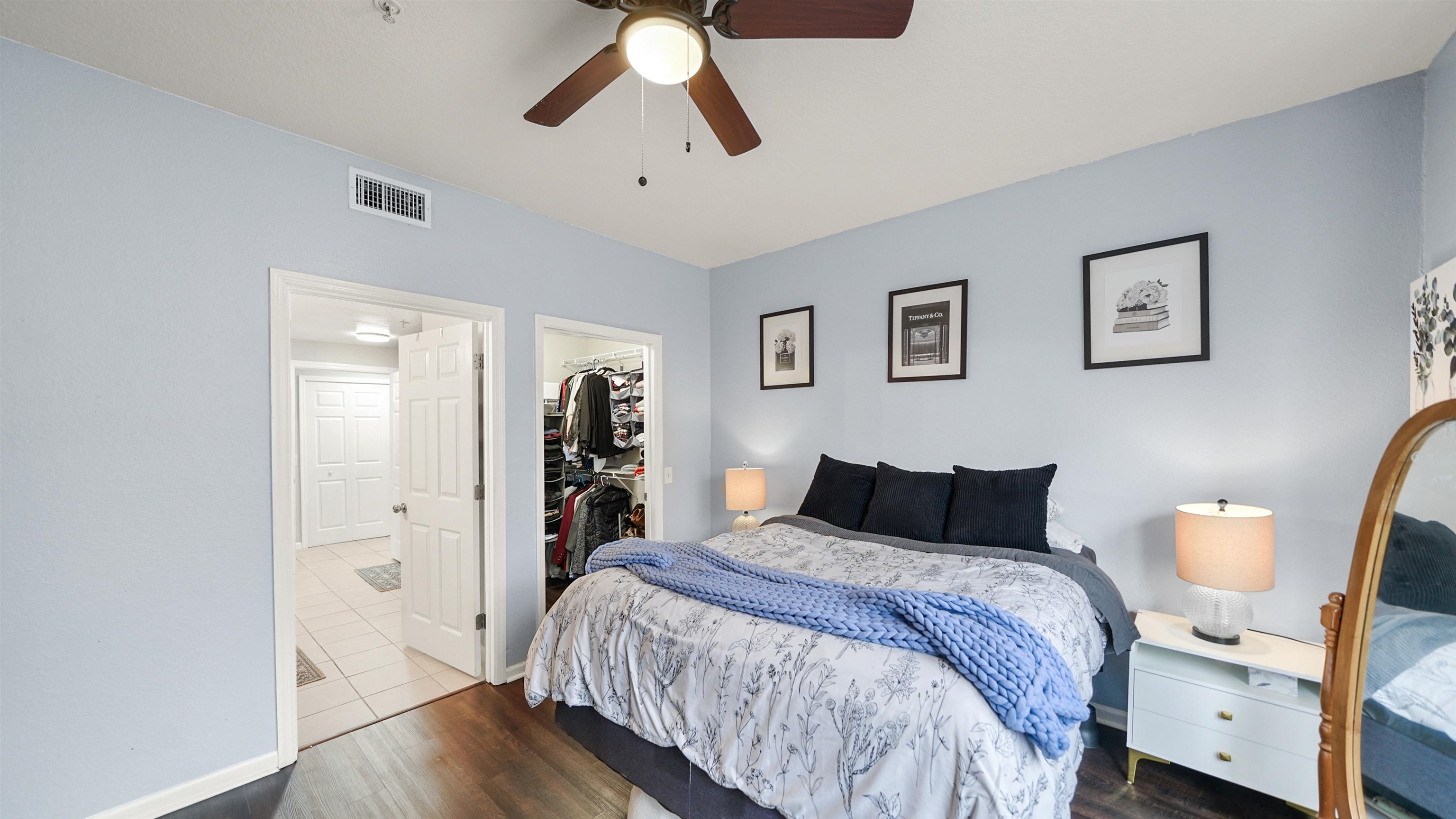 8550 Touchton Road, Unit 625 Jacksonville, FL 32216 - Photo 15 of 47 a bedroom with a bed and wooden floor