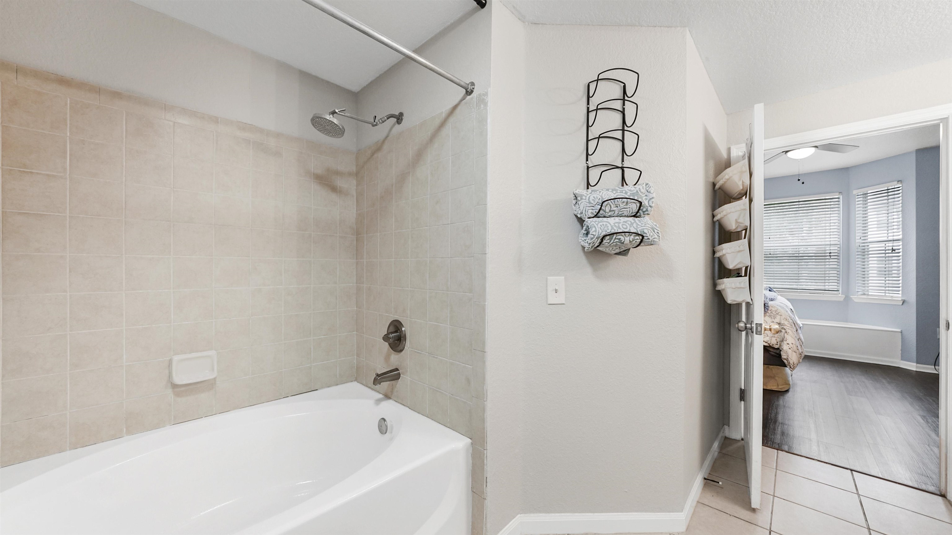 8550 Touchton Road, Unit 625 Jacksonville, FL 32216 - Photo 16 of 47 a bathroom with a bathtub and a shower