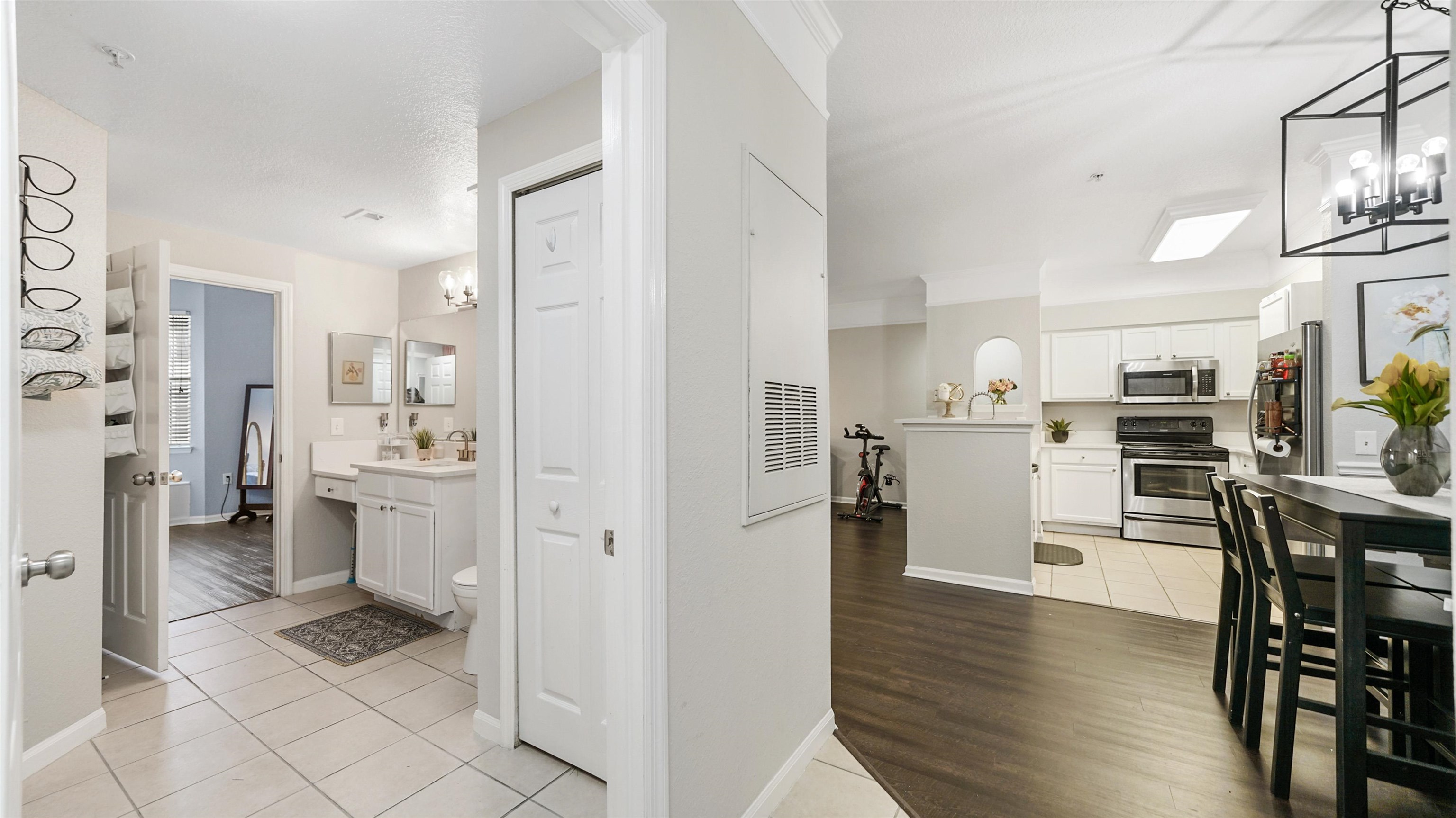 8550 Touchton Road, Unit 625 Jacksonville, FL 32216 - Photo 19 of 47 a kitchen with white cabinets and stainless steel appliances
