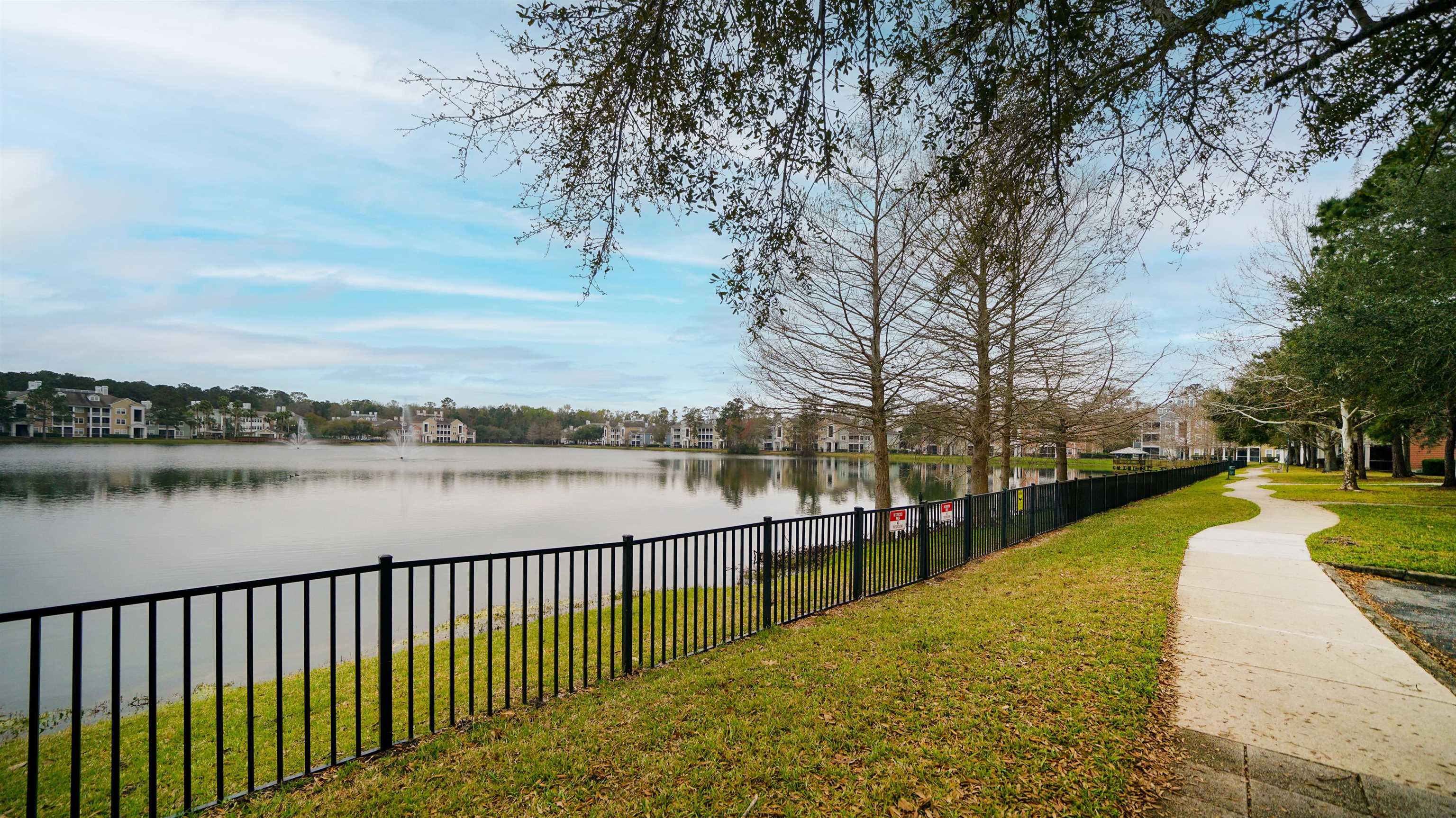 8550 Touchton Road, Unit 625 Jacksonville, FL 32216 - Photo 22 of 47 a view of a lake with a large trees