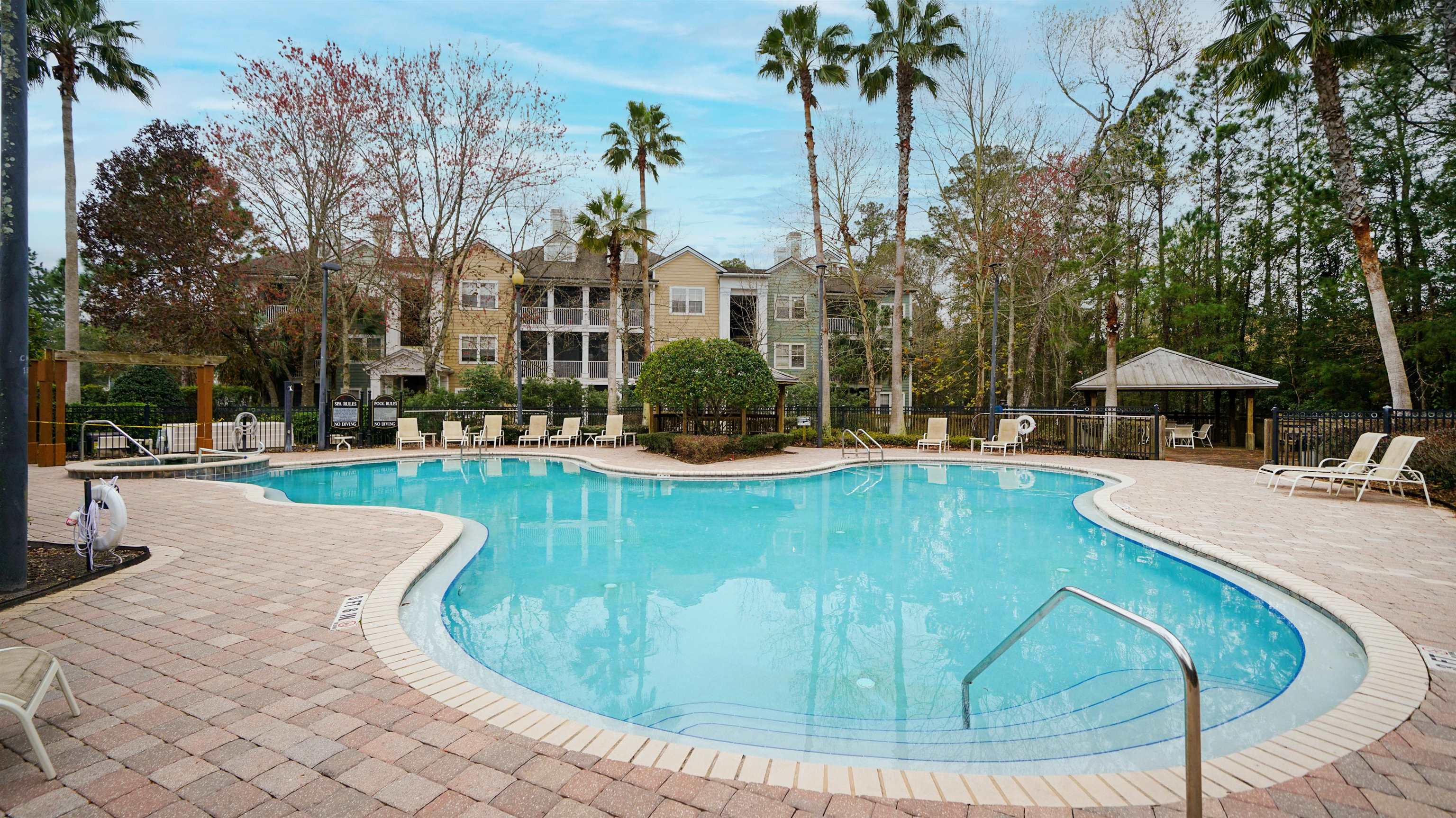 8550 Touchton Road, Unit 625 Jacksonville, FL 32216 - Photo 24 of 47 a view of a swimming pool with a patio