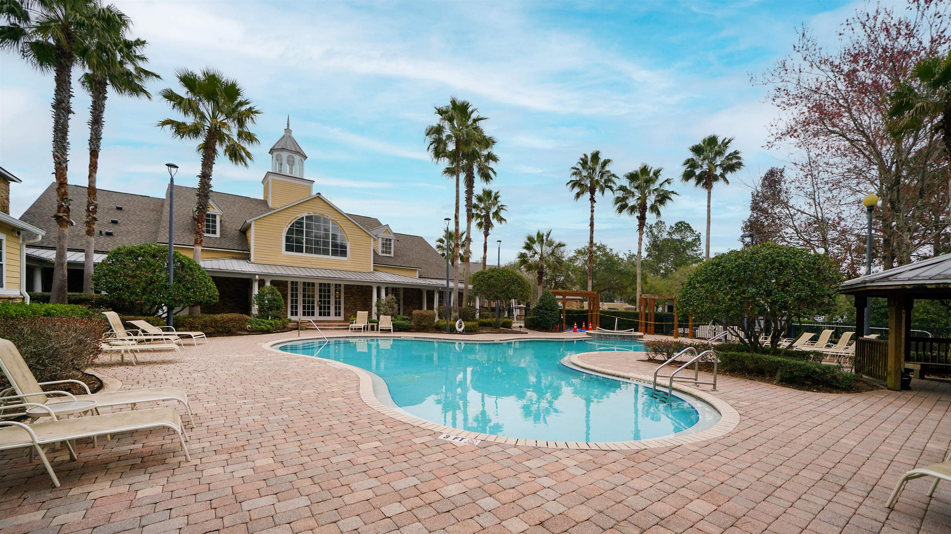 8550 Touchton Road, Unit 625 Jacksonville, FL 32216 - Photo 25 of 47 a view of a house with swimming pool and sitting area