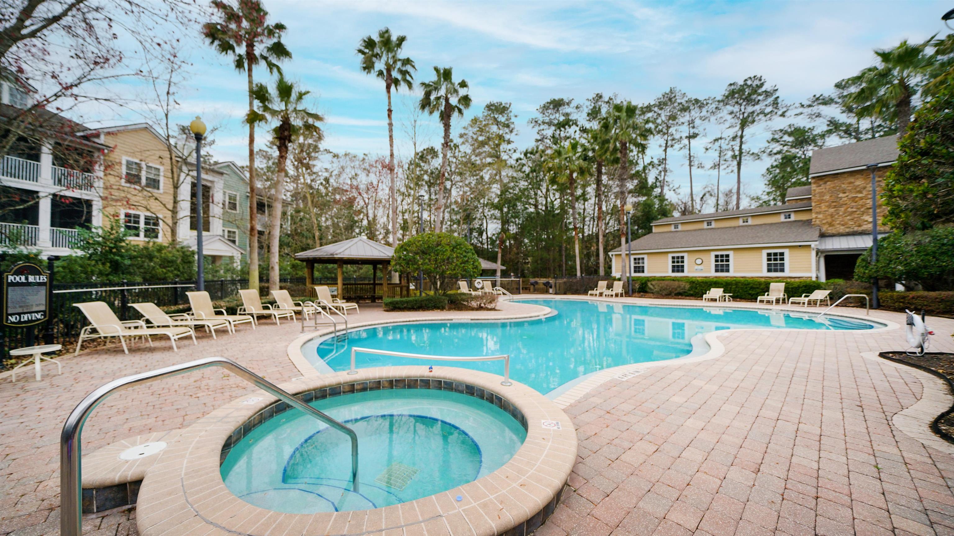 8550 Touchton Road, Unit 625 Jacksonville, FL 32216 - Photo 26 of 47 a view of a swimming pool with a patio