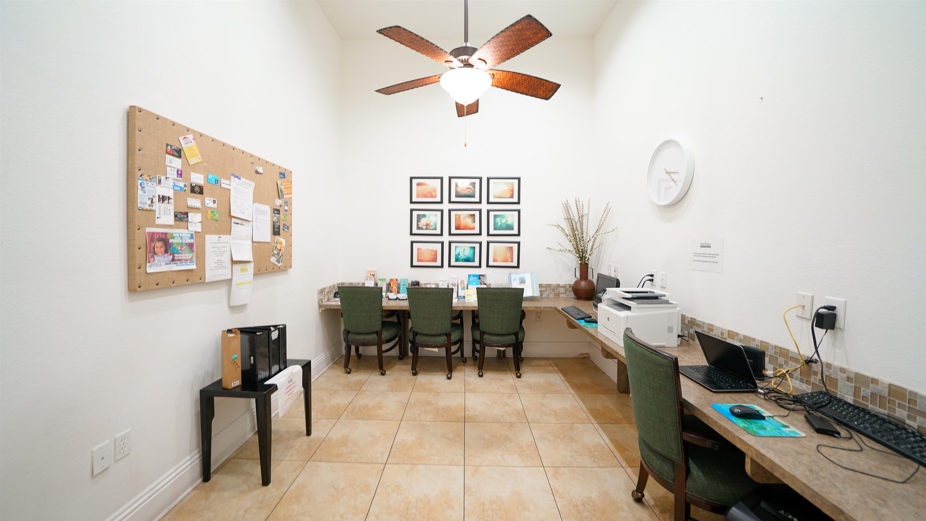 8550 Touchton Road, Unit 625 Jacksonville, FL 32216 - Photo 33 of 47 a living room with furniture a desk and chair with paintings on the wall