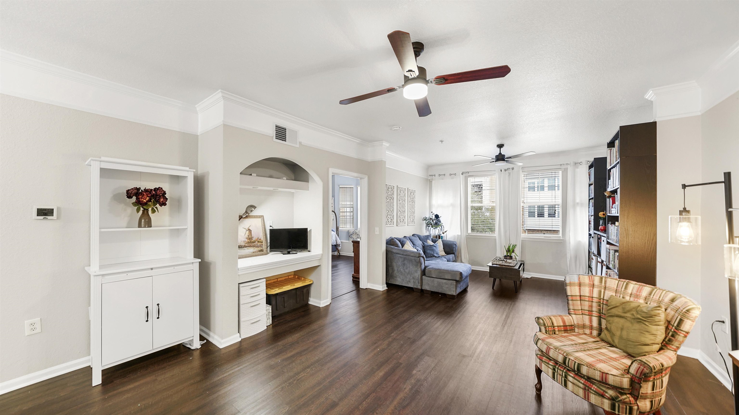 8550 Touchton Road, Unit 625 Jacksonville, FL 32216 - Photo 6 of 47 a living room with furniture kitchen view and a wooden floor