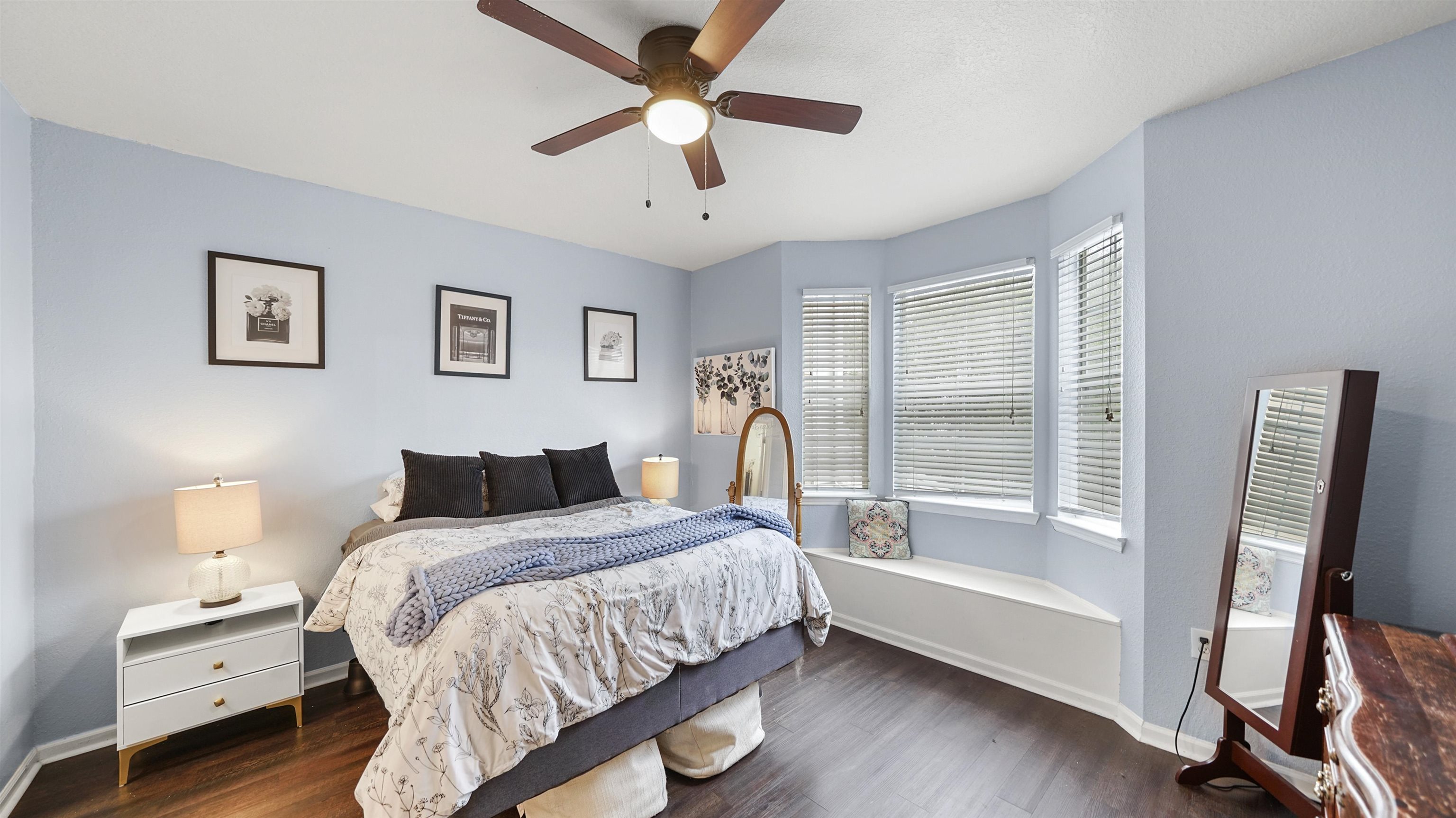 8550 Touchton Road, Unit 625 Jacksonville, FL 32216 - Photo 7 of 47 a bedroom with a large bed and a chandelier