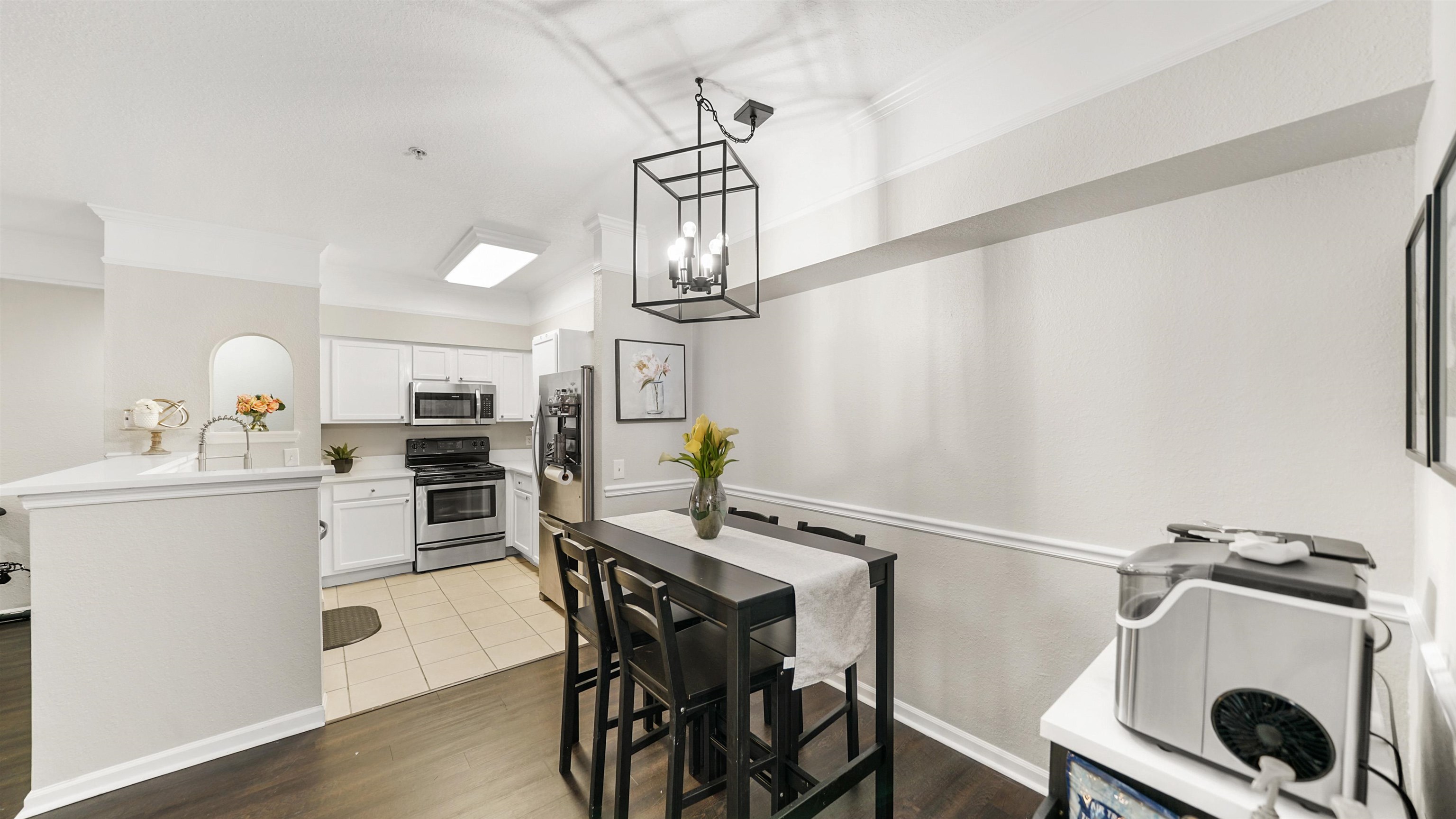 8550 Touchton Road, Unit 625 Jacksonville, FL 32216 - Photo 9 of 47 a view of a dining room with furniture and wooden floor