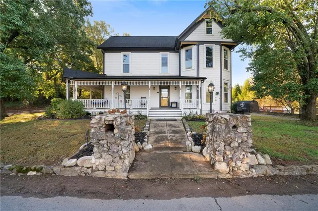 a front view of a house with garden