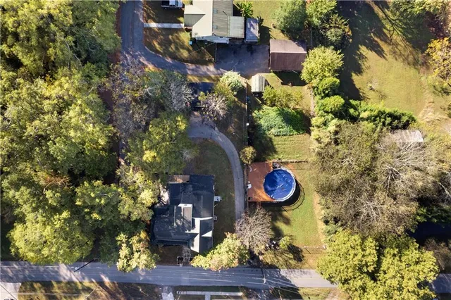 a front view of a building with a garden