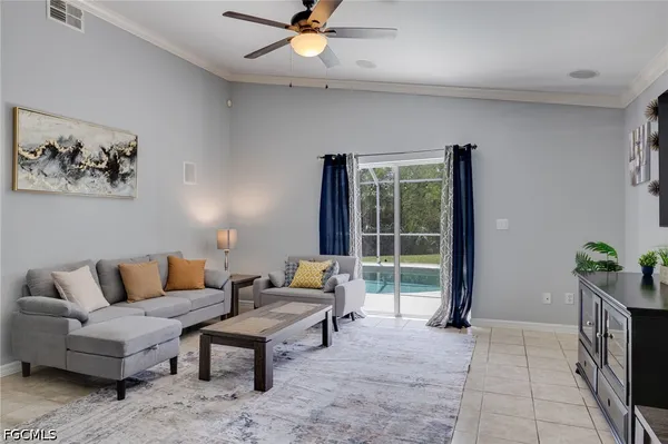 a living room with furniture and a window