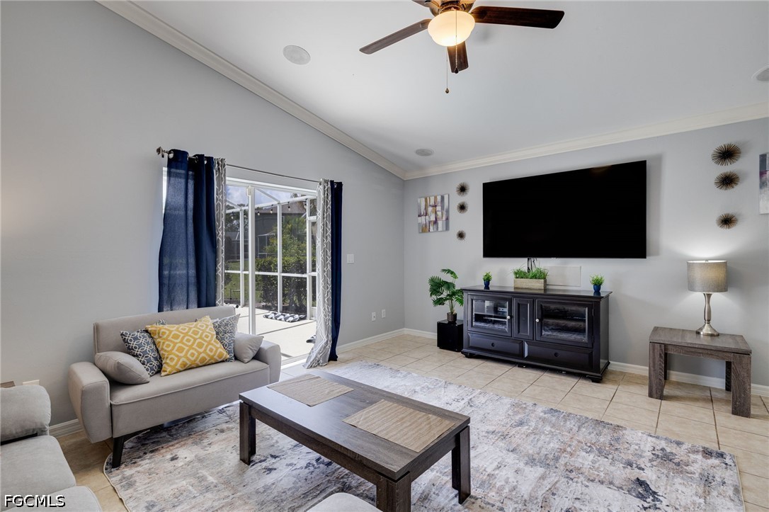 21711 Brixham Run Loop Estero, FL 33928 - Photo 12 of 32 a living room with furniture and a flat screen tv