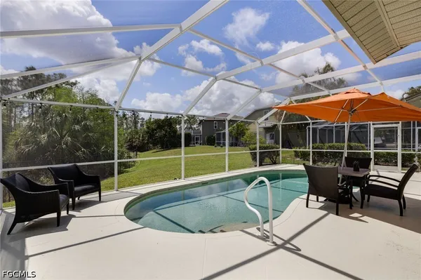 a view of a swimming pool with a lounge chair