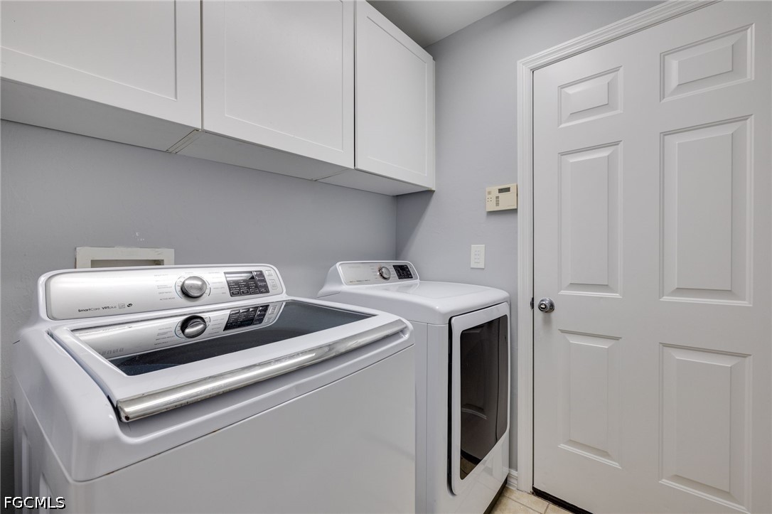 21711 Brixham Run Loop Estero, FL 33928 - Photo 21 of 32 a utility room with dryer and washer