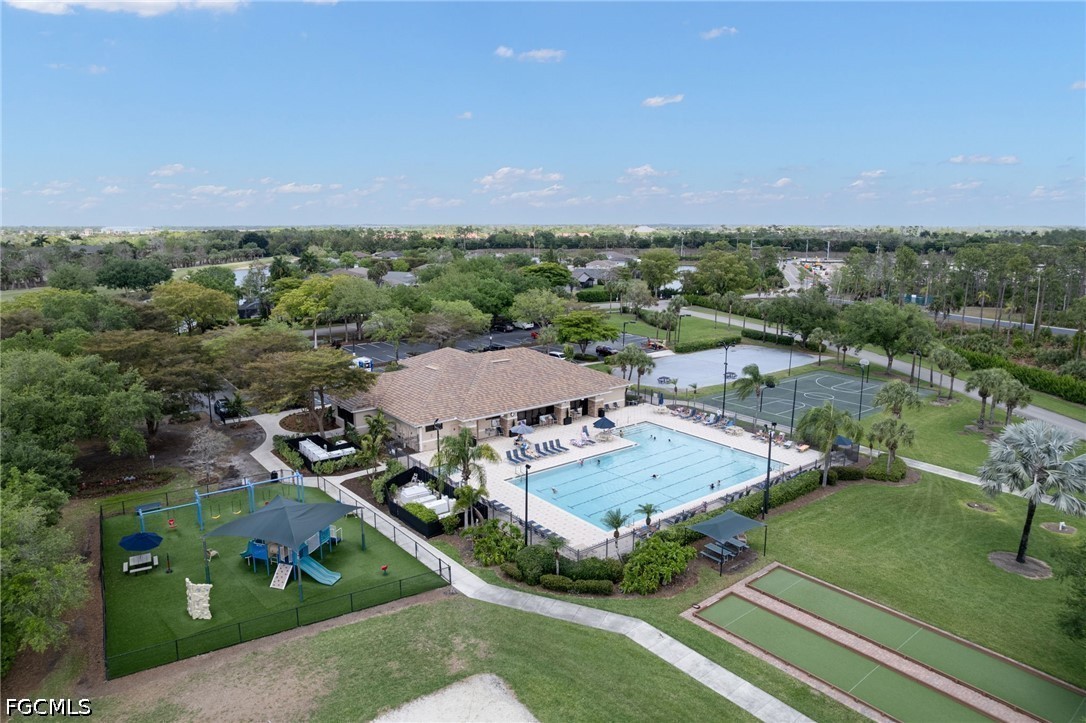21711 Brixham Run Loop Estero, FL 33928 - Photo 24 of 32 an aerial view of residential houses with outdoor space and trees