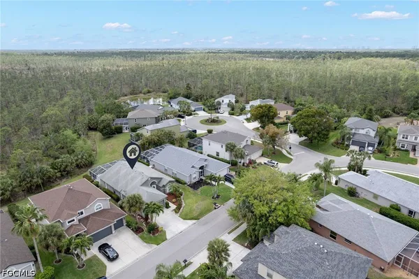 an aerial view of a houses with a lake view