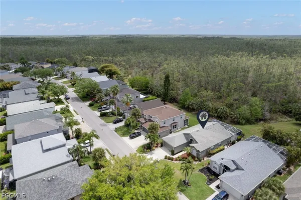 an aerial view of a houses with a lake view