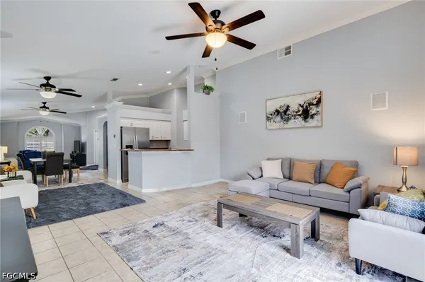 a living room with furniture and a rug