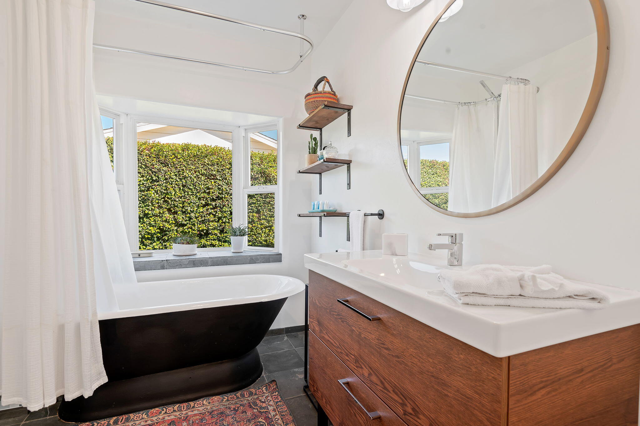 308 Cooper Road Santa Barbara, CA 93109 - Photo 24 of 41 a bathroom with a sink and a mirror
